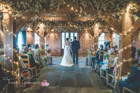 Ceremony In Our High Beam Barn Decorated With Colourful Flowers And Fairy Lights Kent Weddi Barn Wedding Decorations Barn Wedding Venue Kent Wedding Venues