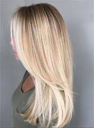 The golden highlights stand out against the dark roots in this softly fading look. Nice Blonde Color In 2020 Hair Styles Hair Highlights Gold Hair Colors