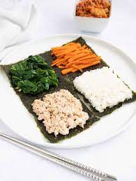 I've also taken lot of pictures so you can see exactly how to roll kimbap, or gimbap, is a korean dish made of seasoned cooked rice and various fillings that are rolled in dried seaweed, and cut into bite size pieces. Folded Kimbap Korean Tortilla Hack Christie At Home