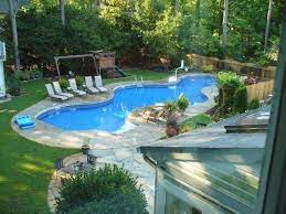 Backyard with pool and swing set. I Can Totally See This As My Backyard Dream Backyard Swimming Pool Landscaping Backyard Pool