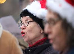 Carolers spread old-time Christmas joy in Brookside