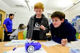 QuestBotics founder testing system with Flagstaff Academy students' help