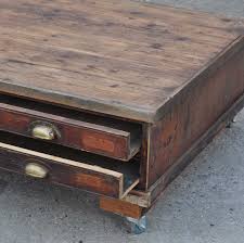 We love the intentional weathering throughout, which lets the wood's natural grain color variation shine through. Vintage Plan Chest Coffee Table On Wheels Home Barn Vintage