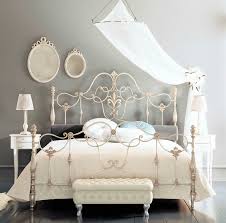 Absolutey gorgeous french country style outdoor terraced space with shabby white painted chipped decorative metal daybed piled with big slouchy faded floral linen cushion's & mattress in soft pastel's, decorative antique chipped shutters painted a soft pale sage green & cream, shabby distressed painted off white/pale blue slatted folding garden chairs, lovely decorative antique shelving, hurricane lamp, small scroll leg stool, rusty decorative iron. Double Bed Erald Giusti Portos Classic Wrought Iron