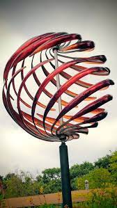 Exquisite Kinetic Wind Sculpture By Mark White Studios These Beautiful Custom Made Moving Metal Pieces Are One Of A Kind This One Is For Wind Sculptures Metal Garden Art Kinetic Art