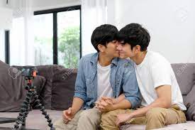 Two Young Asian Men Gay Couple Blogger Kissing While Recording Video, Live  At Home Living Room, Homosexual And Lgbt Concept Stock Photo, Picture and  Royalty Free Image. Image 132814877.