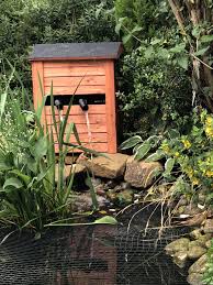 Add sounds to your defense plan. Hiding A Pond Filter Pond Filters Patio Pond Pond
