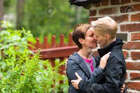 Pictures and videos of girls kissing other girls! Two Girls Kissing Front Of Fence Horizon Format Stock Photo Picture And Royalty Free Image Image 14622575