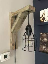 Wall Sconce Using A 2x4 And A Fixture And Cage From Amazon Plans By Shanty2chic Wall Light Fixtures Sconces Outdoor Sconces Sconces