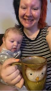 Coffee and 4-month-old baby playing with toys