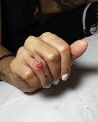 Small heart with arrow tattoo. Small Red Heart And Arrow Tattoo Idea