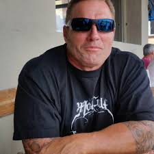 Yup, that's your defending Supercross champion, Rick Johnson waiting for  his turn to throw it sideways in the canyons. (This is the legendary Palm  Avenue) If we're having a throwback race this