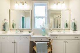 Two Brushed Nickel Bath Lights With Chrome Faucets Chrome Faucet Bathroom Mirror Framed Bathroom Mirror