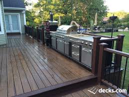 This Backyard Project Includes A Multilevel Trex Deck With Cooking Area Leading Down To A Cambridge S Patio Deck Designs Backyard Kitchen Deck Designs Backyard