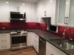 If your dream kitchen is a rustic but modern farmhouse style, white shiplap à la joanna gaines can be a great backsplash option. Modern White Kitchen Cabinets With Red Glass Backsplash Red Kitchen Cabinets Red Kitchen Red And White Kitchen