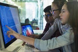 You can only learn javascript at the moment, plus the basics of algorithms. Students Programming At Computer In Computer Lab Classroom Multi Ethnic Group Touching Stock Photo 202447386