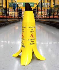 This Slippery Floor Warning Sign Looks Like A Banana Peel Wet Floor Signs Wet Floor Point Of Sale Display