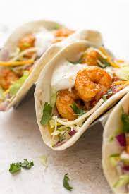 Diced mango and cilantro bring it all together for a complex slaw that will take shrimp and fish tacos to a whole other level. These Easy Shrimp Tacos Make The Best Quick Weeknight Dinner Recipes Shrimp Tacos Easy Shrimp Recipes Easy