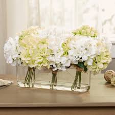 Multicolored hydrangea arrangement various colors of hydrangeas take on a stately elegance when grouped together in a tall vase. Charlton Home Hydrangea Centerpiece In Glass Vase Reviews Wayfair