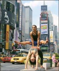 Acro Yoga In Times Square Partner Yoga Partner Yoga Poses Couples Yoga