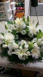 Should the ceremony be after the cremation, you may prefer a special floral design that surrounds the cremation urn with flowers. Beautifully Fitting For Cremation Urn Funeral Arrangements Funeral Urn Arrangements Funeral Flowers