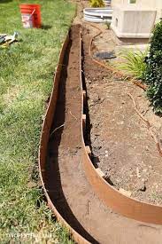 Spread a layer of sand in the bottom of the trench. Install Concrete Landscape Edging Aka Concrete Border Twofeetfirst