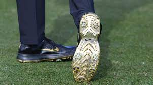 Why Tiger Woods Is Wearing Gold Accented Nike Golf Shoes In The Match