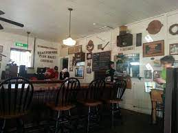 Whistle stop cafe's homemade hamburger patty topped with real cheddar, bacon, lettuce, tomatoes, pickles, and your choice of condiments. Looking Down Main Street Juliette Ga Picture Of Whistle Stop Cafe Juliette Tripadvisor