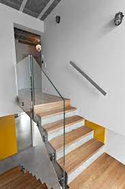 Cool Gray Meets Happy Yellow In This Angular Interior Concrete Staircase Stairs Design Concrete Stairs