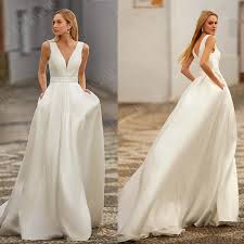 From traditional to modern to boho, with jumpsuits in between! Cheap Satin Beach Wedding Dresses With Pocket V Neck Boho Bridal Gowns White Robe De Married 2021 Simple Bride Dresses Wedding Dresses Aliexpress
