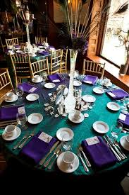 This peacock tablescape uses purple, gold, green and teal to create a gorgeous table setting that can also be used for mardi gras table decor. Teal And Purple Wedding Decorations Novocom Top