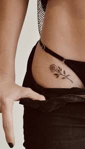 Under the arm on the ribs. 30 Delicate Flower Tattoo Ideas Mybodiart
