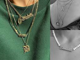 The jewelry trends in the early 90s reflected grunge styles—think chokers, leather cuffs, safety pin bracelets, gothic crosses, and oversized studs. The 20 Best Nameplate Necklaces And The Style S Origins Who What Wear