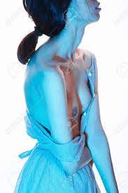 Woman With A Beautiful Naked Breast In Blue Color.sexy Girl In Dress With  An Open Breast Stock Photo, Picture and Royalty Free Image. Image 86959054.