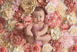 The headband consists of a peach and lavender shabby flower as well as a light pink, tulle, puff flower. Melissa Calise Photography Photographer Ideas Beautiful Baby Girl Flowers Pink White Knit Romper He Baby Girl Photography Baby Photography Toddler Photography