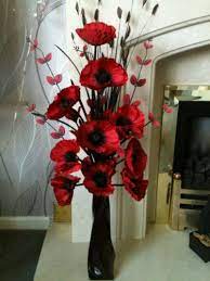 Why silk flower arrangements win over fresh flowers? Artificial Silk Flower Arrangement In Red Poppies In Black Modern Vase Drie Artificial Silk Flower Arrangements Fake Flower Arrangements Flower Arrangements