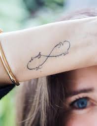 Elegant 3 wrap bracelet with name initials tattoo designs on wrist. Flaunt These Stylish 30 Name Tattoos To Honor Your Loved Ones