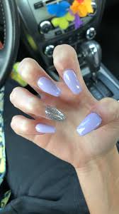 Coffin nails have been in the fashion since the past few years, but it seemed to be going nowhere as that of french manicure. Light Purple Purple Coffin Nails With Glitter Nail And Manicure Trends