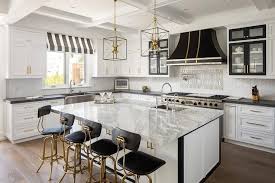 Black And White Marble Kitchen Countertops White Kitchen Designed With Black Countertops And Gold Accents Featuring An Island Topped Kitchen Concepts Marble Countertops Kitchen Best Kitchen Countertops