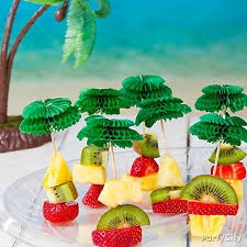 However, if you feel like hosting a beach party luau, go with beach party music and pull out the campy decorations such as the plastic hula dolls and cardboard palm trees. Party Ideas Luau Food Luau Party Food Luau Food Ideas