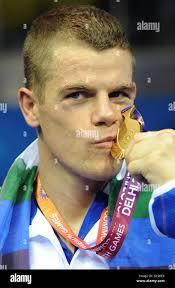 Scotland's Callum Johnson celebrates winning the gold medal in the light  heavy weight final during Day Ten of the 2010 Commonwealth Games at the  Talkatora Indoor Stadium in New Delhi, India Stock