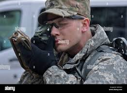 Army Reserve Staff Sgt. Alexander Lacourse grades competitors during the  hand-release push-up event at the 2022 Best Squad Competition's Army Combat  Fitness Test. Approximately 50 Soldiers from across the nation travelled to