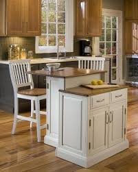 Home Styles 5010 948 Woodbridge 2 Tier Kitchen Island With 2 Stool White Finish By Kitchen Island With Seating White Kitchen Island Stools For Kitchen Island Islands not only provide extra functionality in the way of storage and work space to the kitchen, they also add a social element as a gathering place.