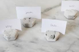 Match the names of friends and family to images on playing cards before gluing them to sticks or straws. Diy Faux Marble Place Card Holders Almost Makes Perfect