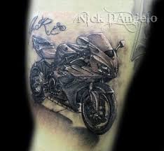 Motorcycle tattoos are symbols of status, power, speed and control. Motorbike Tattoo Nick D Angelo Tattoos For Guys Biker Tattoos Tattoo Designs