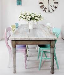 Shabby Dining Table With Multi Colored Pastel Chairs Gives This Room A Vibrant And Inviting Feel Shabby Chic Dining Shabby Chic Dining Room Vintage Dining Room