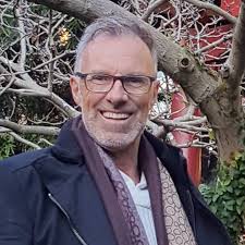 This is my Quesnelia 'Tim Plowman' in flower It is a popular cultivar of Q.  marmorata. It is known for its tall, upright leaves that curl at the top.  Keep, it in