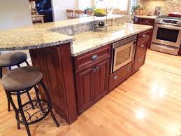 In other cases, a lower, standard table height surface can also be attached instead of a bar height surface. Buffalo Grove Kitchen With 2 Tier Island American Traditional Kitchen Chicago By Trilogy Kitchens Houzz