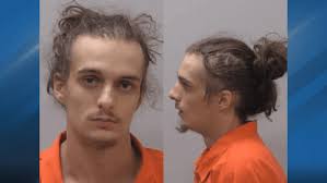 Man charged after driving car with several passengers into Kalamazoo bank