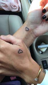 Boyfriend And Girlfriend Tattoos Hearts Hand And Wrist Tattoos Black Nail Polish Girlfriend Tattoos Small Couple Tattoos Matching Couple Tattoos